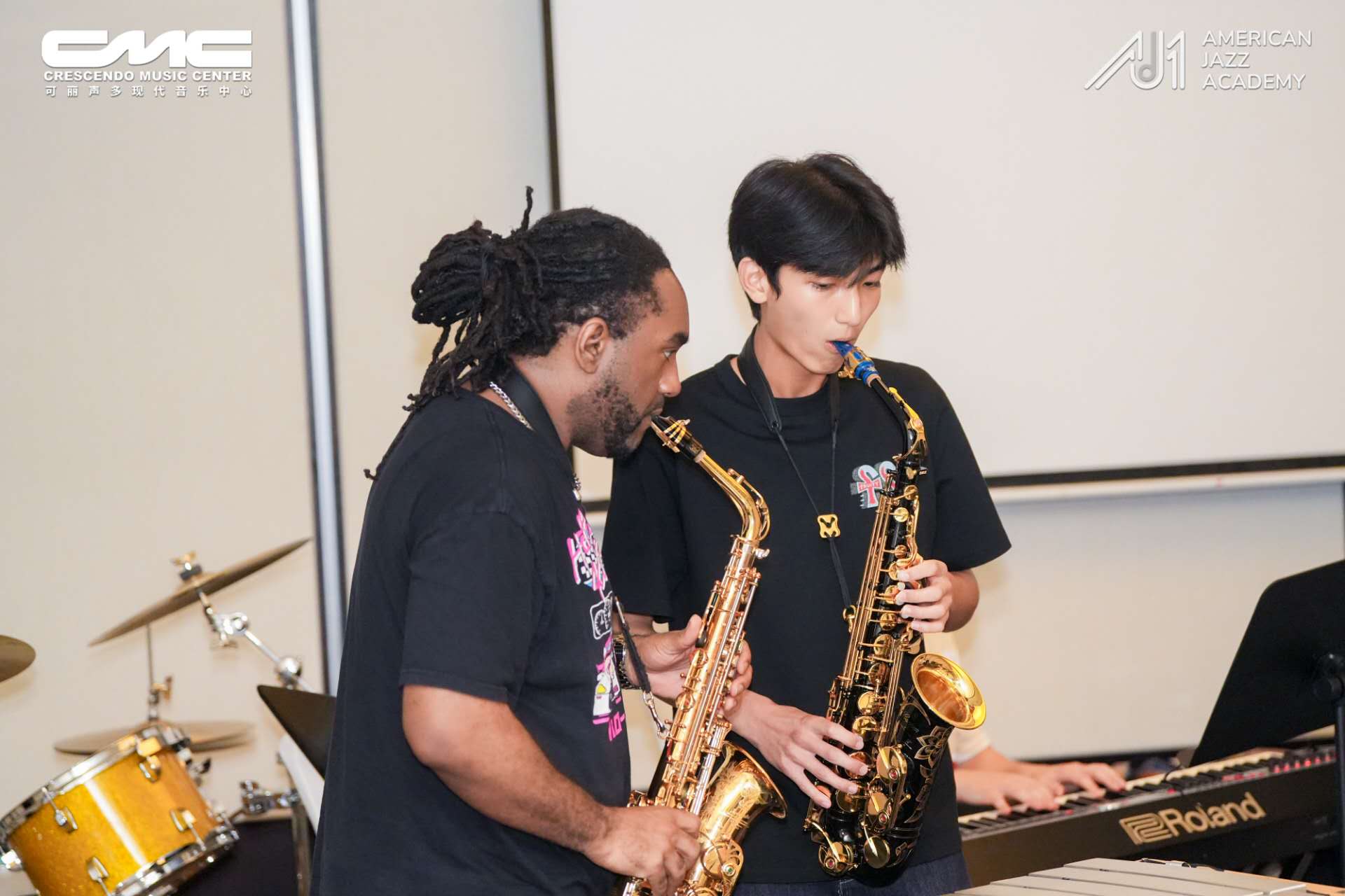 Wilson playing alto saxophone with Patrick Bartley